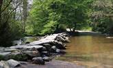 Visit the ancient Tarr Steps close to Dulverton. This historic clapper bridge is an iconic landmark in this beautiful National Park. - Thumbnail Image