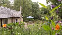 This is the side of the cottage you will see as you walk down the path from the parking-area above.