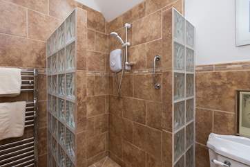 The clever use of glass blocks gives this wet-room a very contemporary feel and it has the added luxury of under-floor heating.