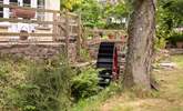 A little stream runs past the front of the cottage - complete with a water wheel. - Thumbnail Image