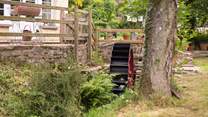 A little stream runs past the front of the cottage - complete with a water wheel.