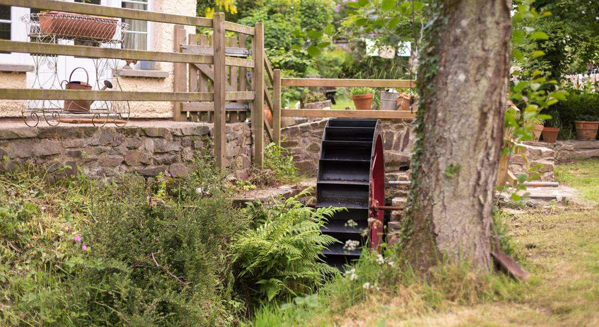 A little stream runs past the front of the cottage - complete with a water wheel.