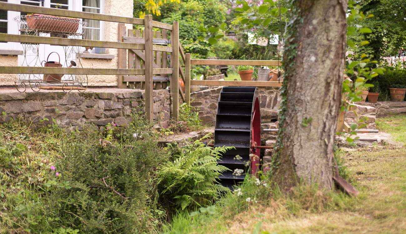 A little stream runs past the front of the cottage - complete with a water wheel.