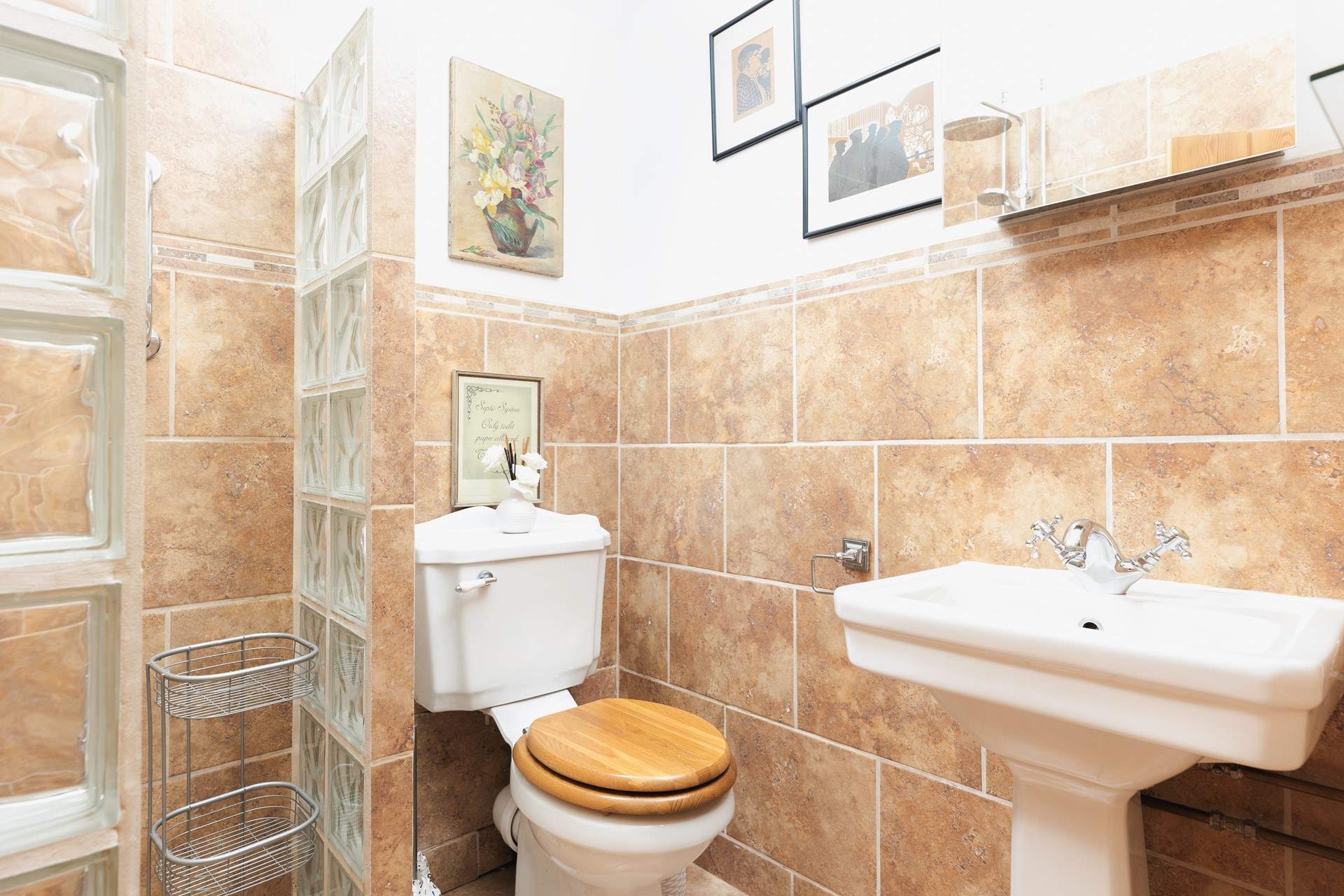 The shower-room has a wet-room style walk-in shower.