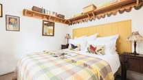 The bedroom is filled with warm touches to make you feel welcome and at home.