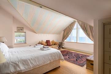 The main bedroom on the first floor with a super-king bed, an en suite and sea views.