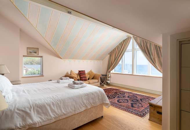 The main bedroom on the first floor with a super-king bed, an en suite and sea views.