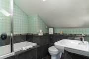 The main bedroom en suite with an overhead shower.