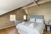 The double bed on the first floor with sea views and an en suite bathroom.