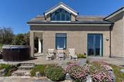 Make the most of the sun and sea views with the sun loungers and bubbling hot tub.
