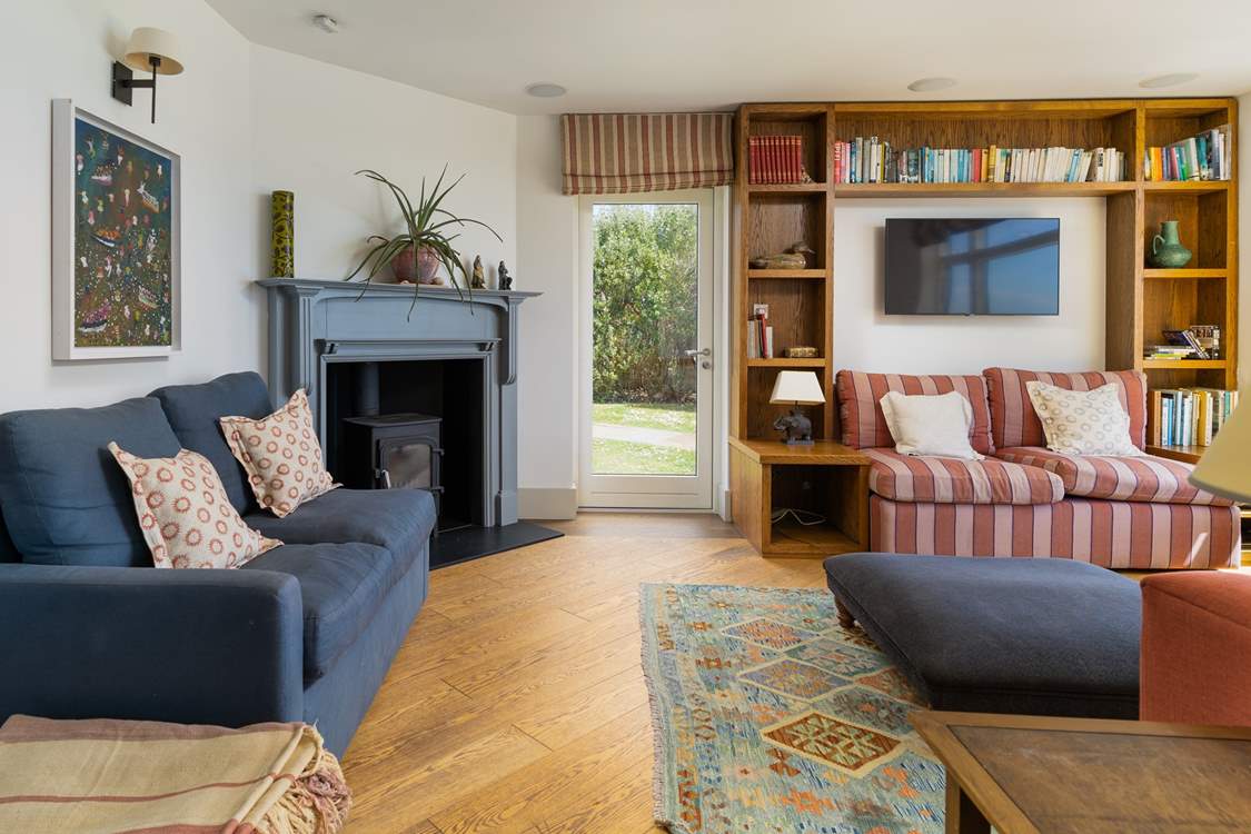 The cosy sitting-room with welcoming wood-burner.
