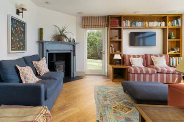 The cosy sitting-room with welcoming wood-burner.