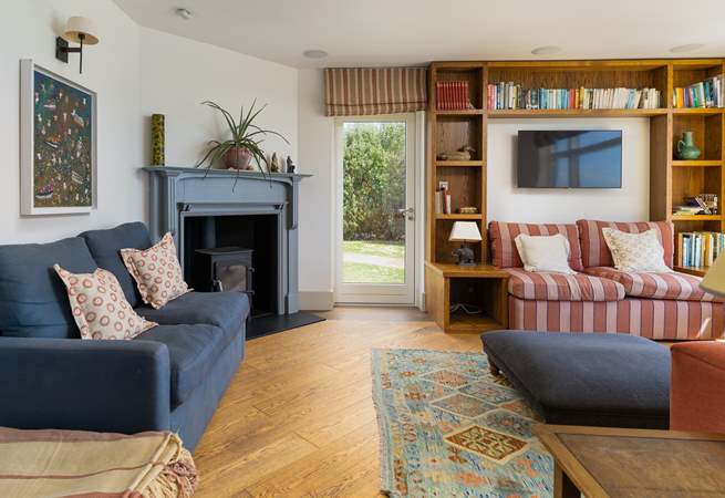 The cosy sitting-room with welcoming wood-burner.
