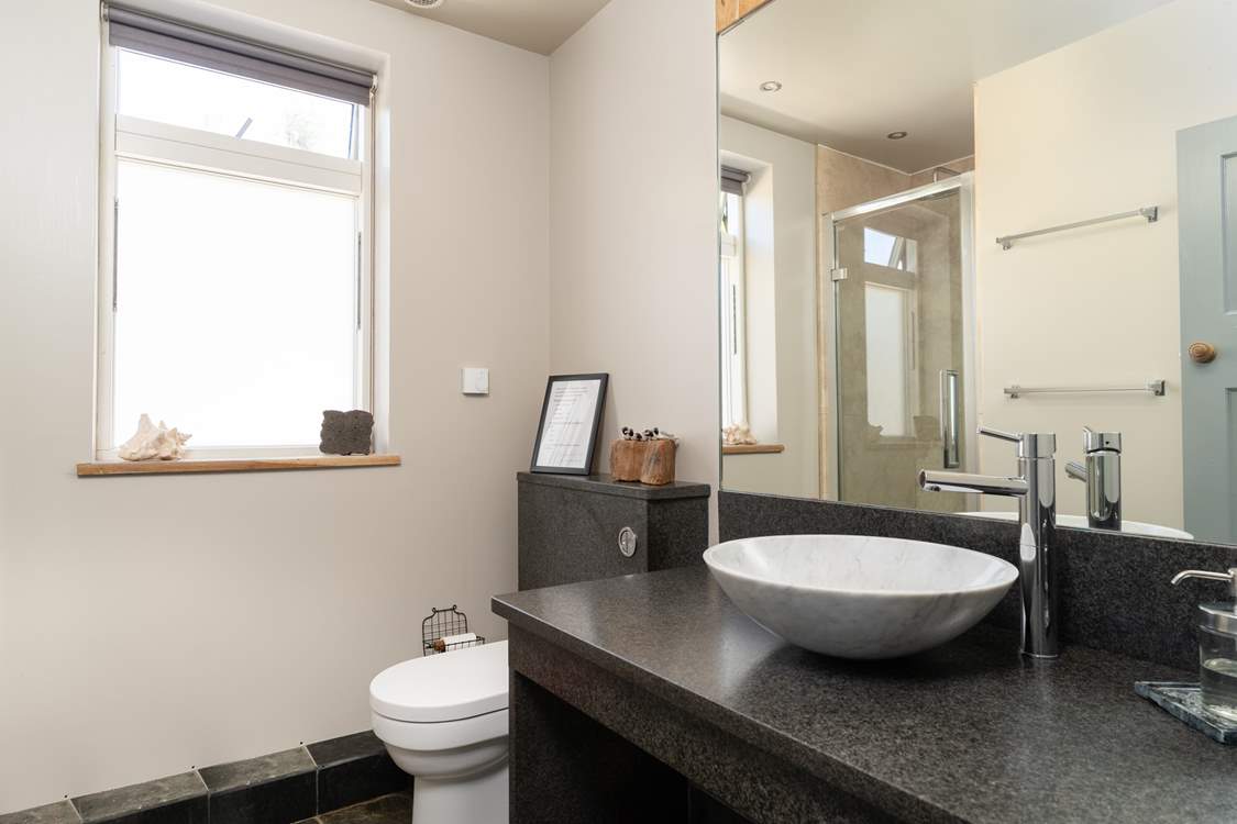The ground floor shower-room with a waterfall shower.