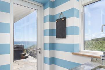 Access to the hot tub and stunning sea views from the kitchen.