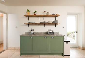 The back door leads out to the gardens and hot tub.