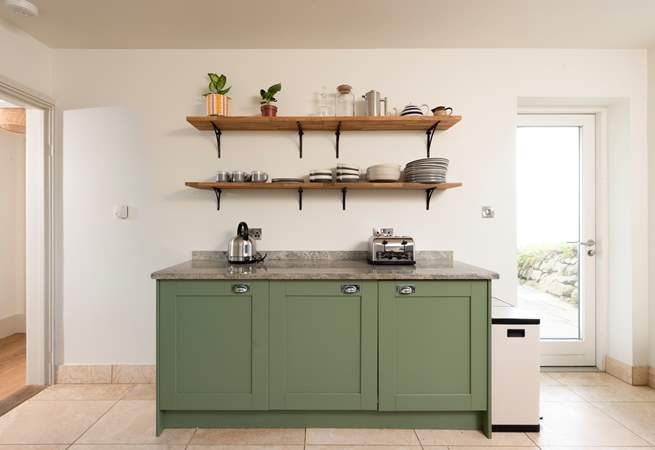 The back door leads out to the gardens and hot tub.