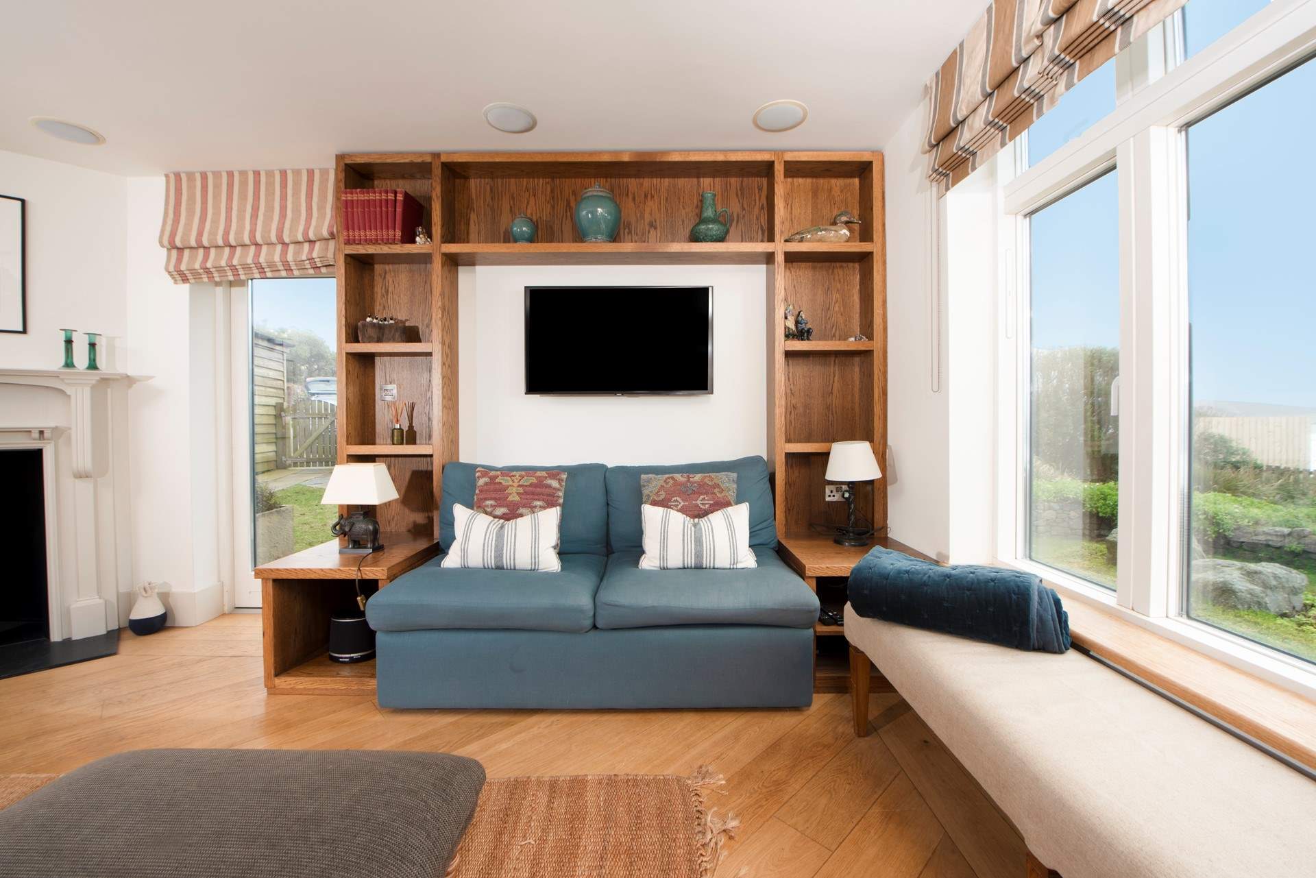 A welcoming room with windows that flood the space with light. Light the cosy wood-burner on chillier evenings.