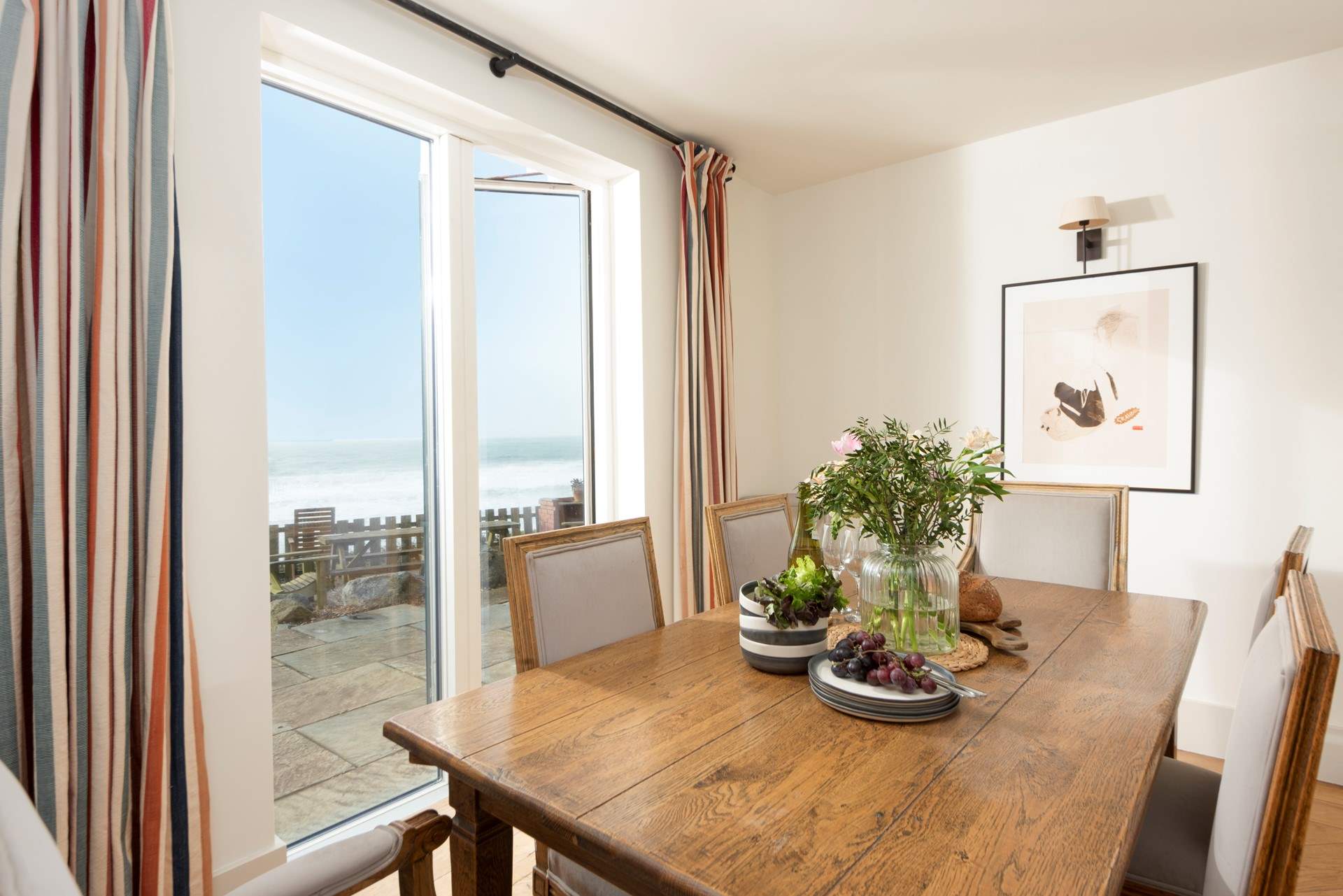 The doors from the dining area open onto the terrace and gardens.