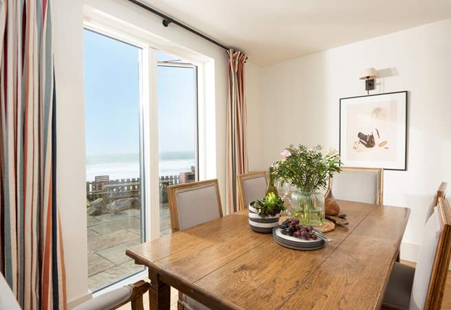 The doors from the dining area open onto the terrace and gardens.