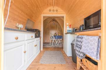 Looking from the entrance, through the kitchen to the dining-area.