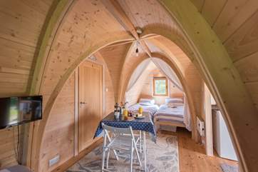 The twin beds are tucked away to one side of the pod.
