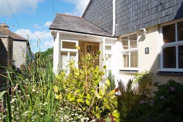 The cottage also has an enclosed front courtyard.