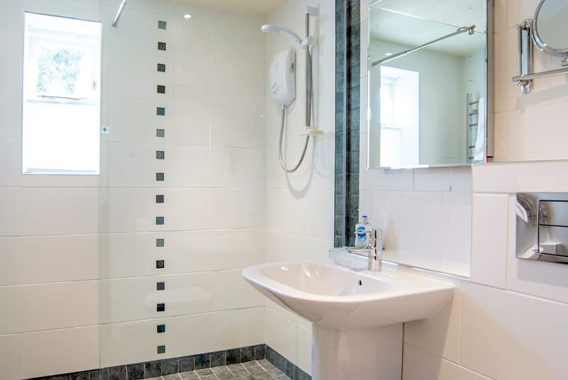 The wet-room has a large walk-in shower.