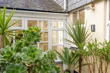 The pretty entrance with attractive potted plants.