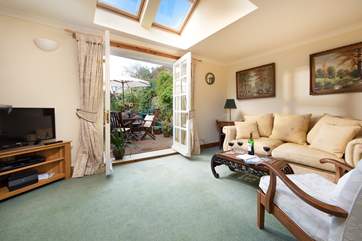 French doors open onto the sunny enclosed terrace.