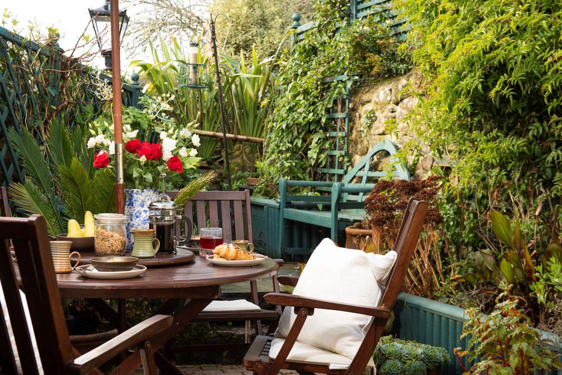 The sunny enclosed terrace, a quiet retreat for a leisurely breakfast.