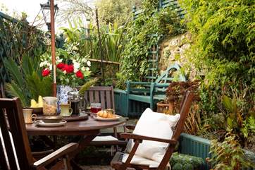 The sunny enclosed terrace, a quiet retreat for a leisurely breakfast.