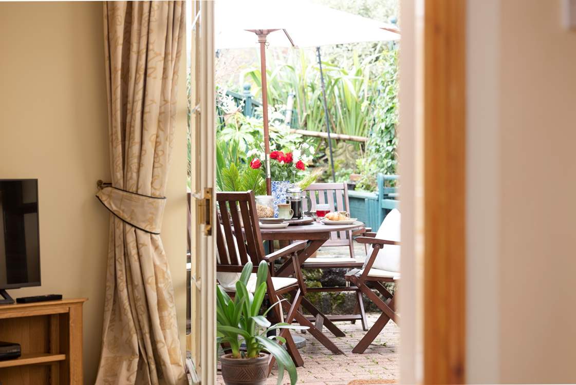 Come outside, the enclosed and pretty terrace is delightful.