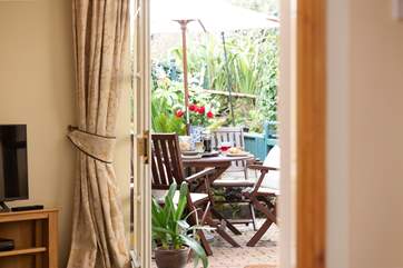 Come outside, the enclosed and pretty terrace is delightful.