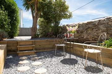 Plan your day ahead over breakfast in the garden.