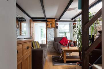 Walk through the sitting-room to the lovely sun-room.