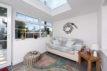 The sun-room overlooks the pretty gravelled terrace.