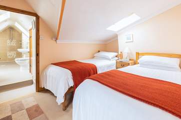 The twin bedroom, leading into the wet room.