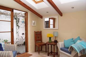The garden-room leads out to a tiny covered courtyard.