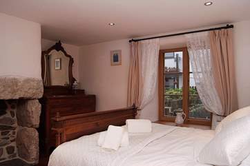 Bedroom 1 with antique furnishings.