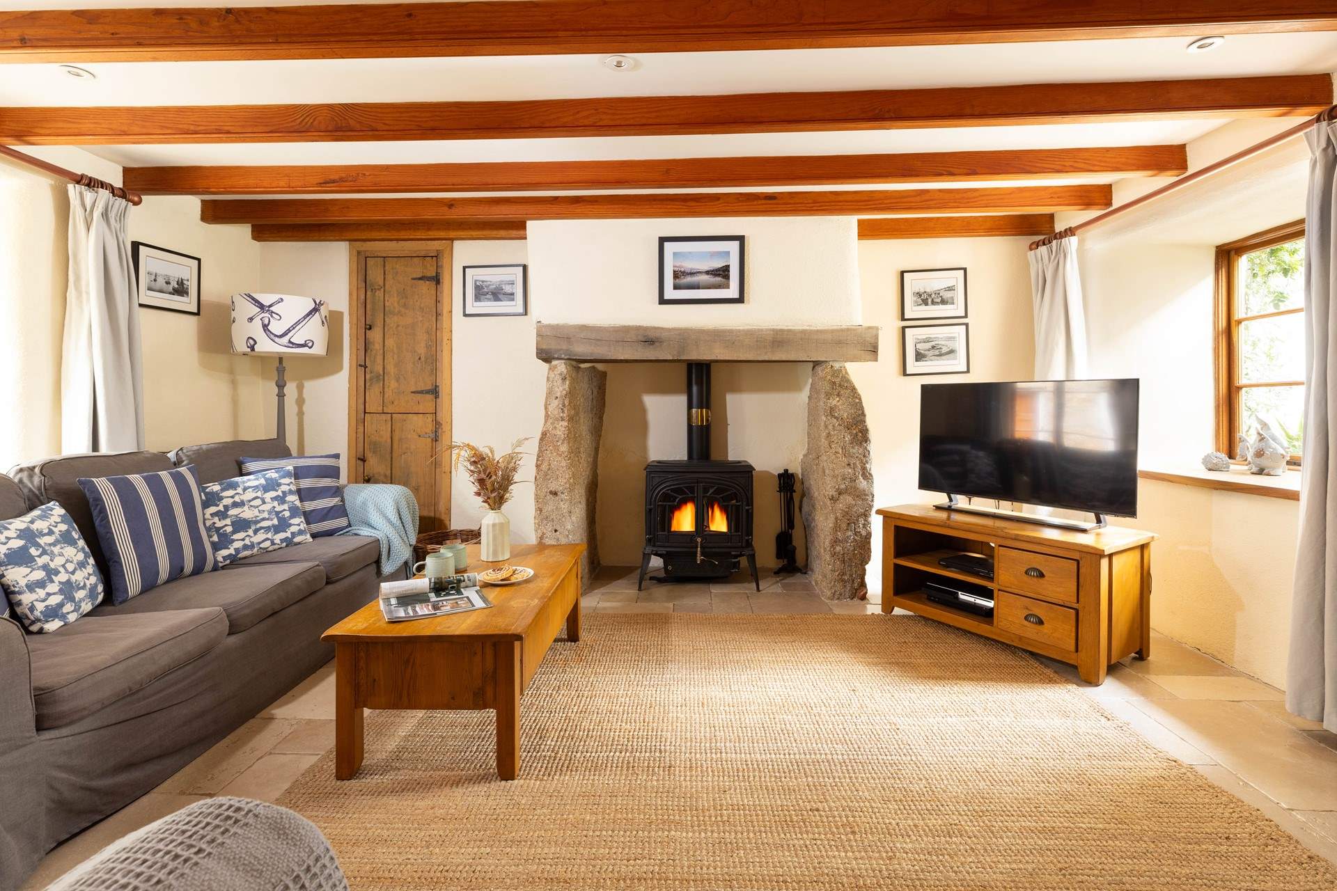 The sitting-room with welcoming wood-burner. 