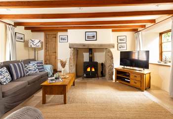 The sitting-room with welcoming wood-burner. 