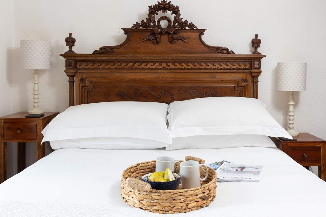 Bedroom 1 with antique furnishings.