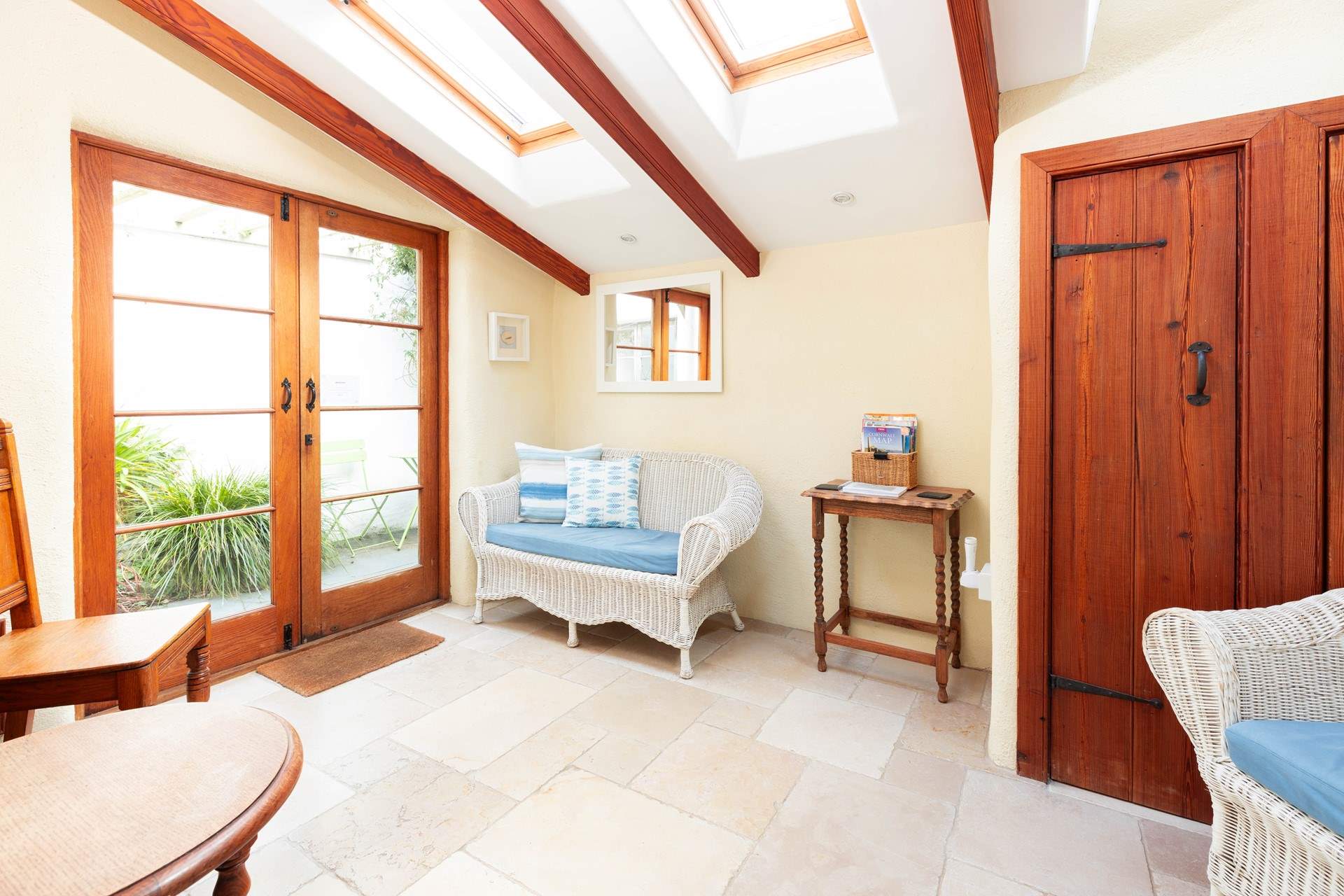 The garden-room leads out to a tiny covered courtyard.