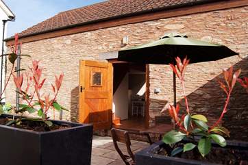 The cottage has a sheltered and enclosed courtyard at the back where you can sit out in the sunshine. There is also seating in the orchard.
