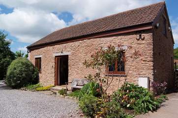 Headford Farm cottage is a very spacious barn conversion on a friendly working farm. The courtyard garden is at the back, and the two paddocks for you to use are to the left.
