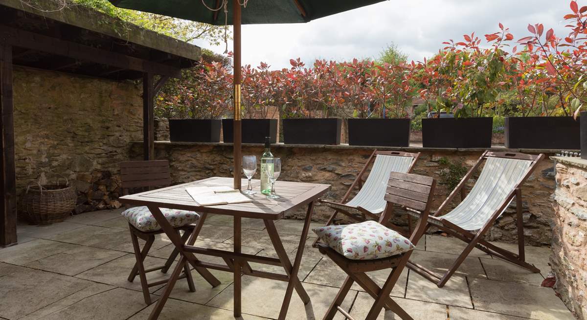 This is another view of the little sitting-out patio at the back of the cottage. Your log store is here too.