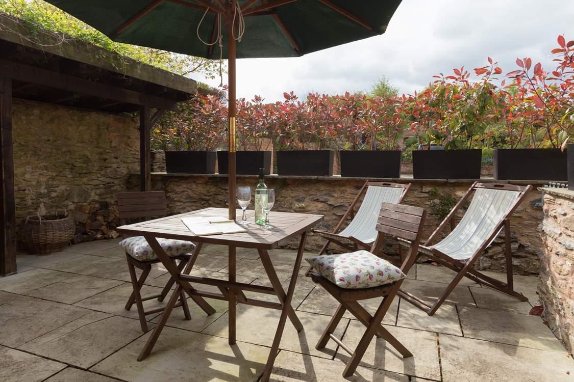 This is another view of the little sitting-out patio at the back of the cottage. Your log store is here too.
