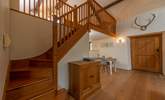 Beautifully crafted wooden stairs lead up to the  mezzanine bedroom area. - Thumbnail Image