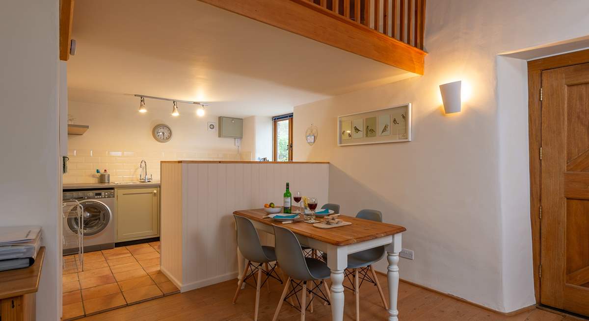 The dining-area and kitchen are cleverly separated by this half-wall. 